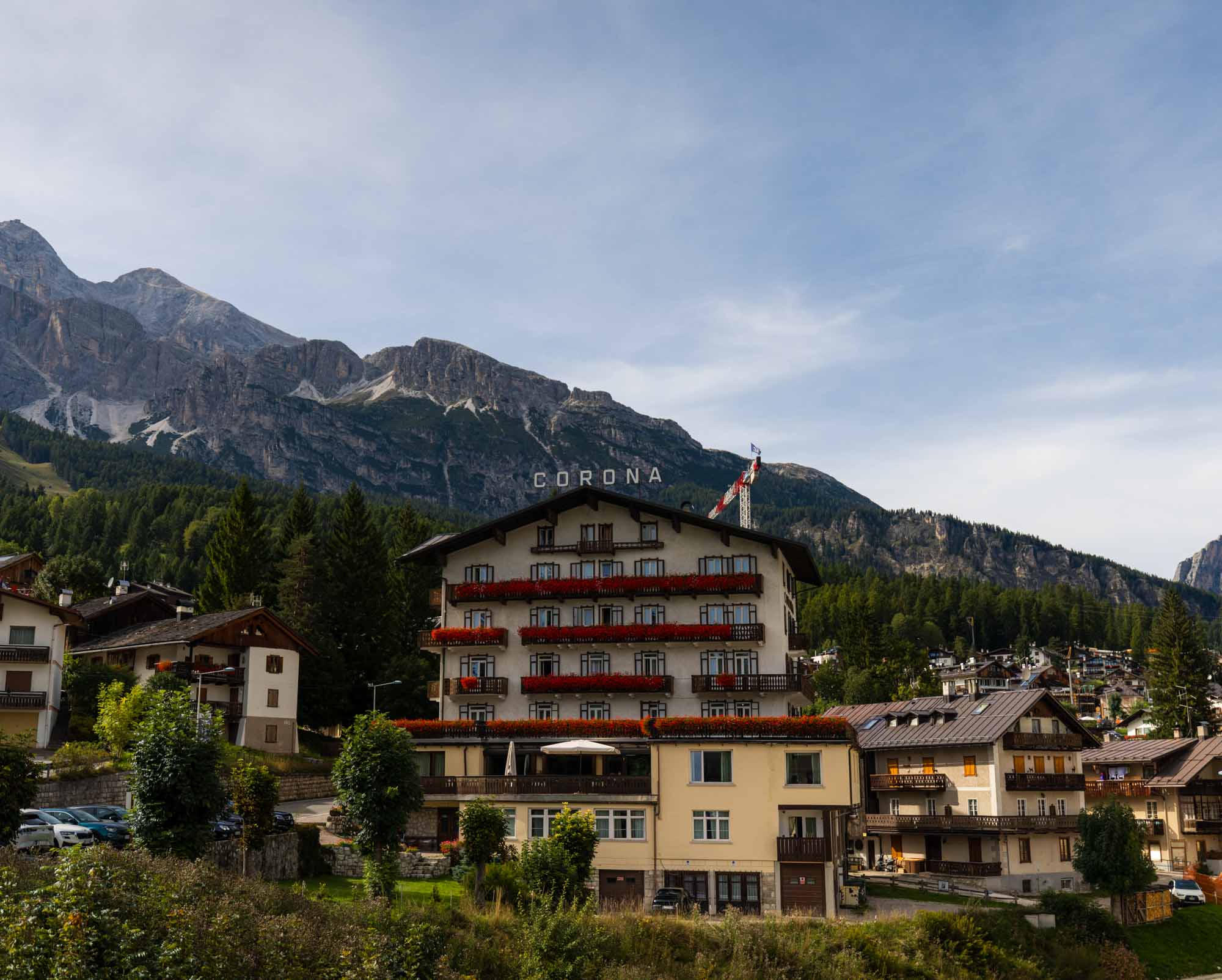 alpine hotel exterior in Dolomites Italy beside mountain river filmed for hospitality video production