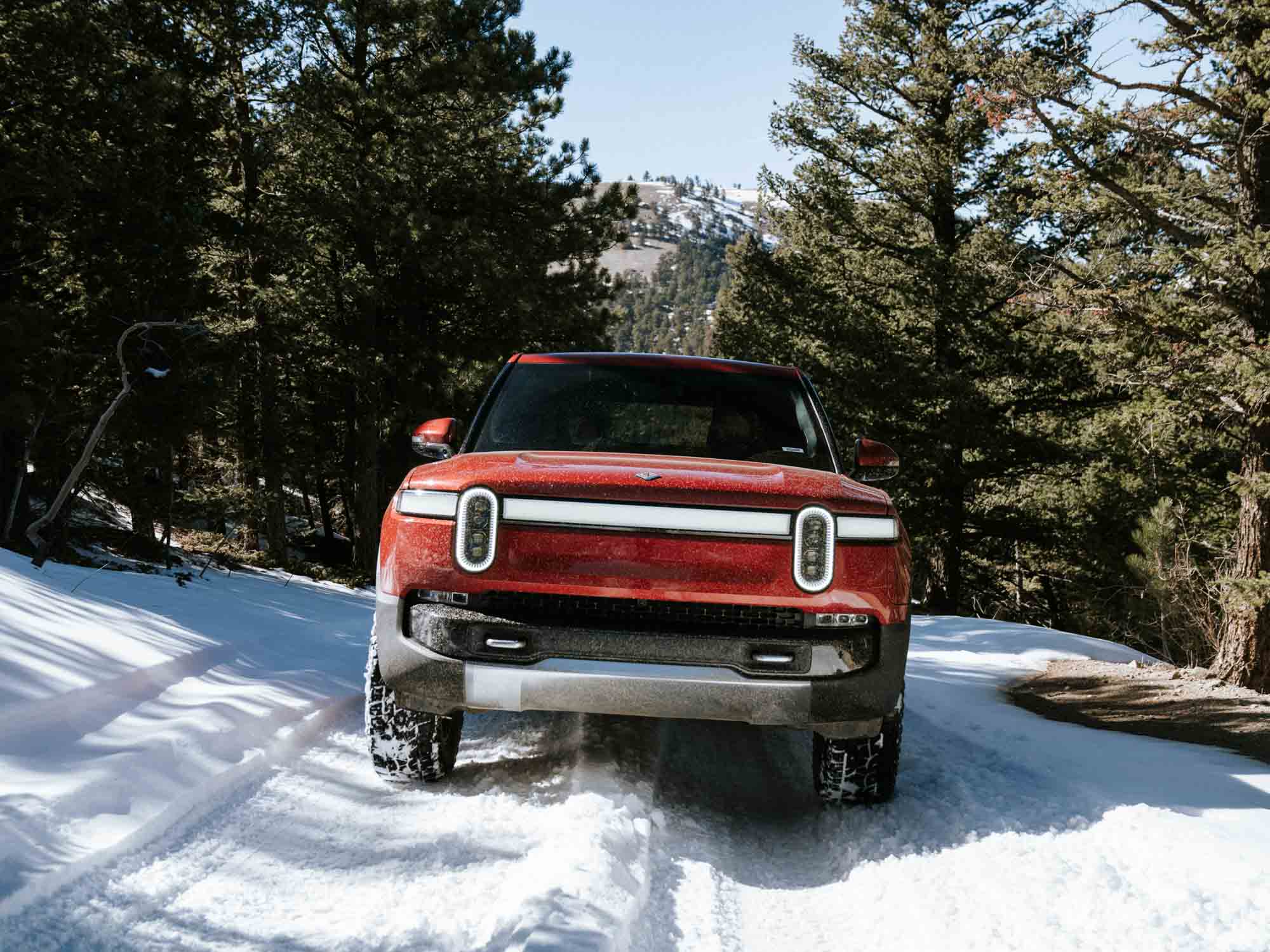 electric adventure rivian truck driving through snowy mountain road in Colorado outdoor commercial video production